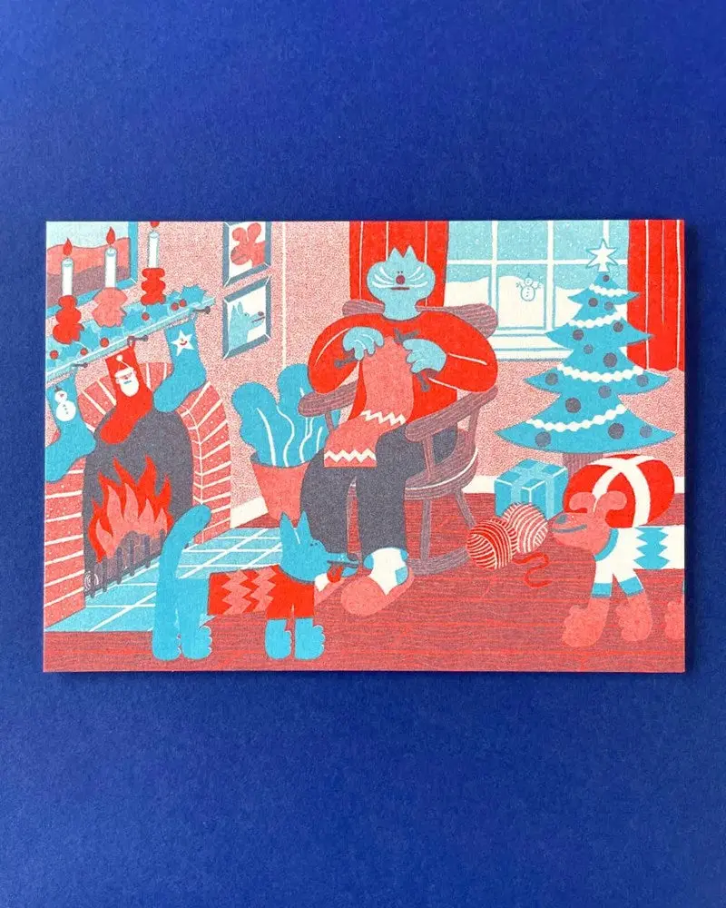 Yuk Fun Christmas Card - Cozy Winter Indoor Knitting Scene 1